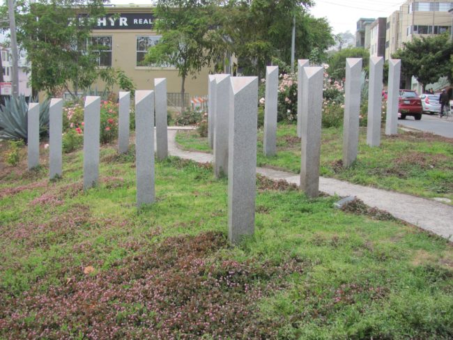 An image of Pink Triangle Park, showing how the pink triangle has been reclaimed on Holocaust Memorial Day 