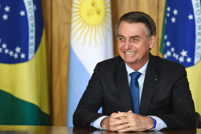 Brazilian President Jair Bolsonaro is pictured during the signing of an agreement with Argentina's President Mauricio Macri (out of frame) at Planalto Palace in Brasilia, on January 16, 2019
