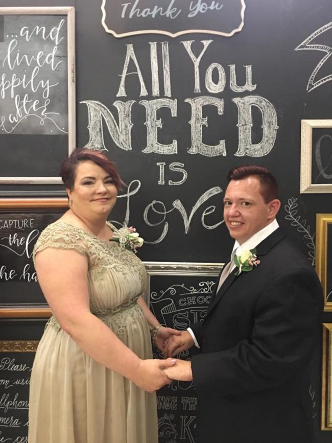 Transgender nurse Jesse Vroegh poses for a wedding picture with his wife Jackie