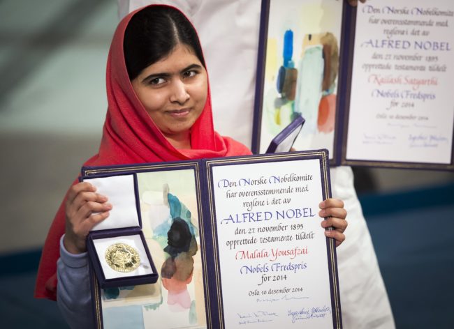 Nobel Peace Prize laureate Malala Yousafzai displays her medal and diploma during the Nobel Peace Prize awards ceremony at the City Hall in Oslo, Norway, on December 10, 2014. 17-year-old Pakistani girls' education activist Malala Yousafzai known as Malala shares the 2014 peace prize with the Indian campaigner Kailash Satyarthi, 60, who has fought for 35 years to free thousands of children from virtual slave labour. 
