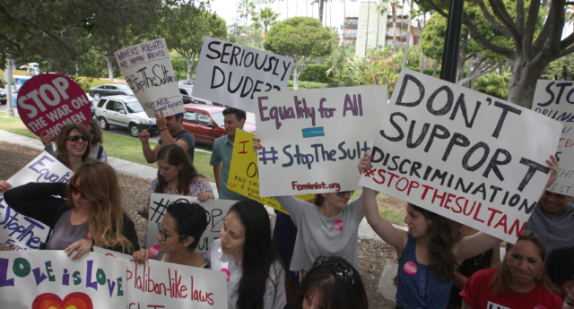 Demonstrators protest the punishment of women and LGBT people announced by the Sultan of Brunei near the Beverly Hills Hotel, which is owned by the Sultan (David McNew/Getty Images)