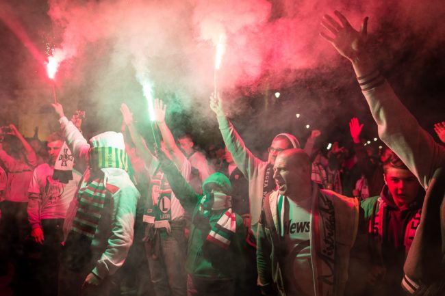 Fans of Warsaw's soccer team Legia Warszawa burn flares as they celebrate their club's victory of the Polish soccer championship on May 15, 2016 in Warsaw.