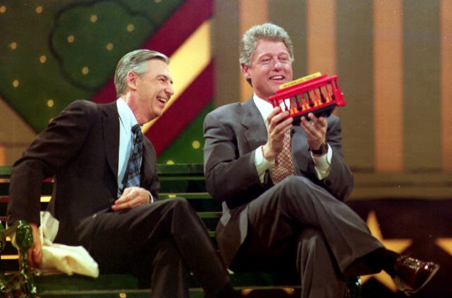 U.S. President-elect Bill Clinton (R) holds a trolley car given to him by Fred Rogers (L) during the Presidential Inaugural Celebration for Children 19 January 1993 at the Kennedy Center. Fred Rogers was the host of the children's show "Mister Rogers' Neighborhood".