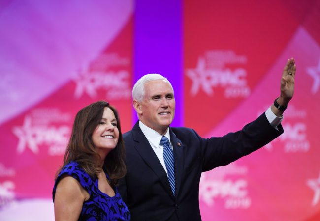 US Vice President Mike Pence, with his wife Karen Pence, arrives to speak at the annual Conservative Political Action Conference (CPAC) in National Harbor, Maryland, on March 1, 2019.