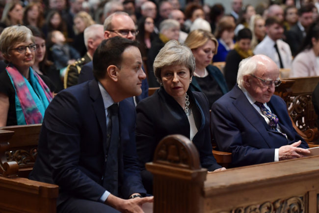 Leo Varadkar, Theresa May and Michael D Higgins sit together in St Anne’s Cathedral. 