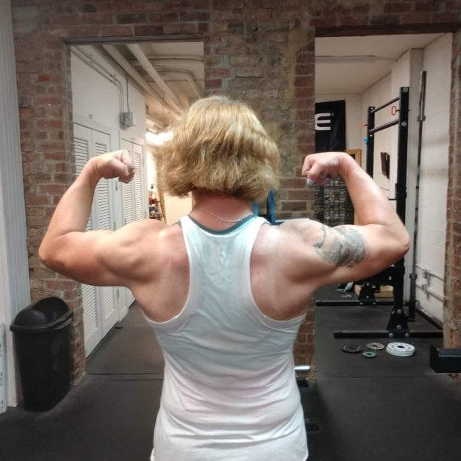 Trans powerlifter Mary Gregory shows her muscles