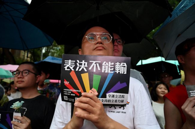 A gay rights supporter displays a placard in support of same-sex marriage in Taiwan. 