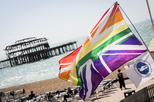 A rainbow Union Jack is flown on the beach during Brighton Pride. 