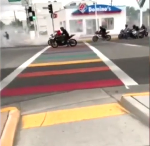 A video captured the bikers performing burnouts over the Albuquerque rainbow crossing